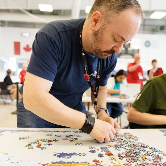 A photo of the founder of Atlas Puzzles, Mark, who is competing in a puzzle competition