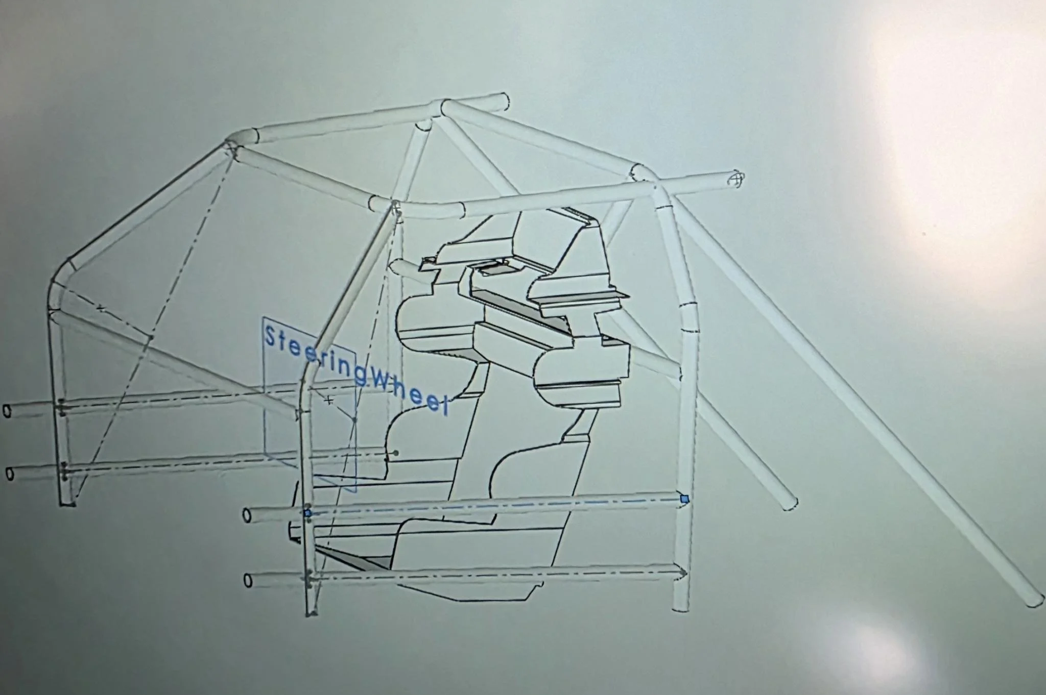 Blueprint of a roll cage for a 2007 Honda Accord showing the placement of a racing seat, control panels, and a steering wheel.