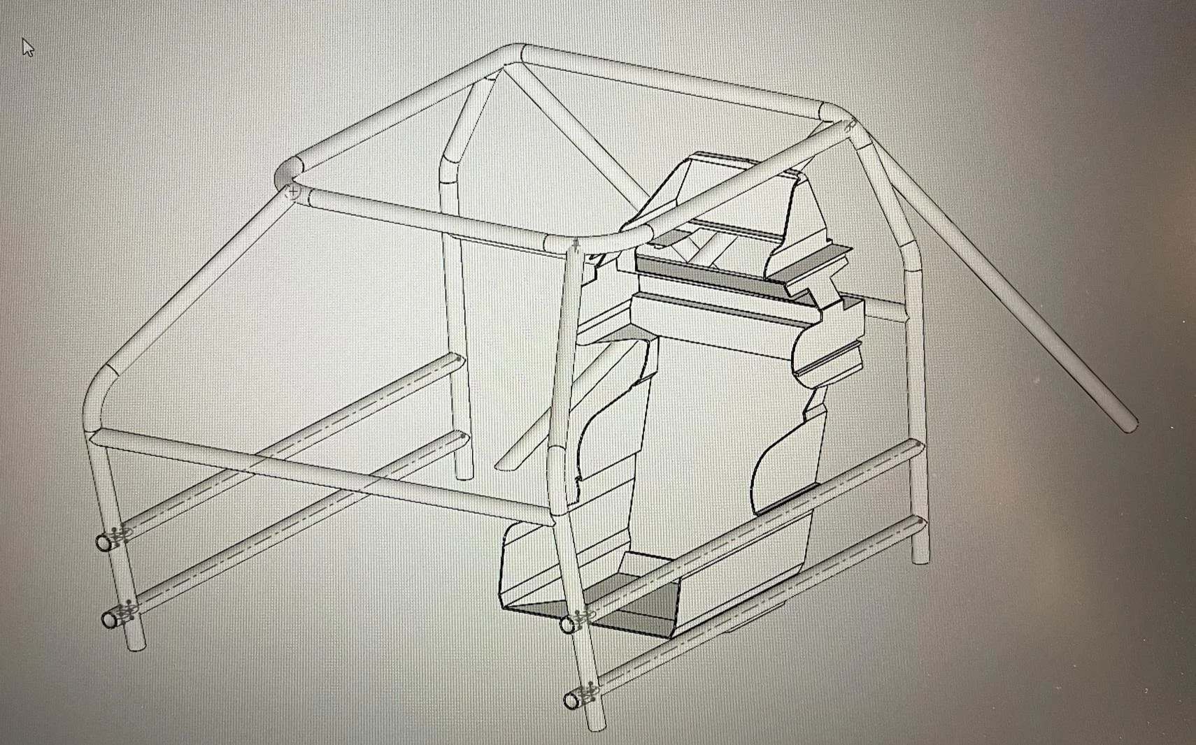 Roll cage for a 2007 Honda Accord showing the placement of a racing seat, control panels, and a steering wheel.