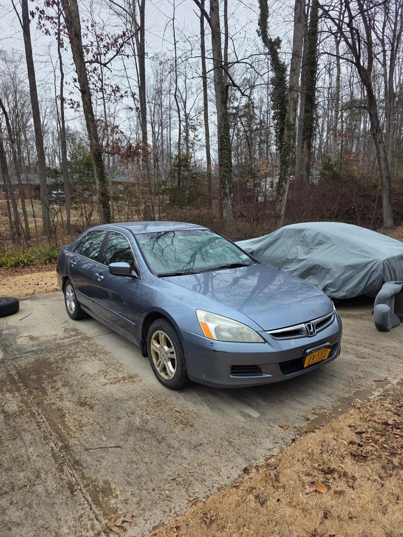 A blue  2007 Honda Accord parked prior to tear down and inspection