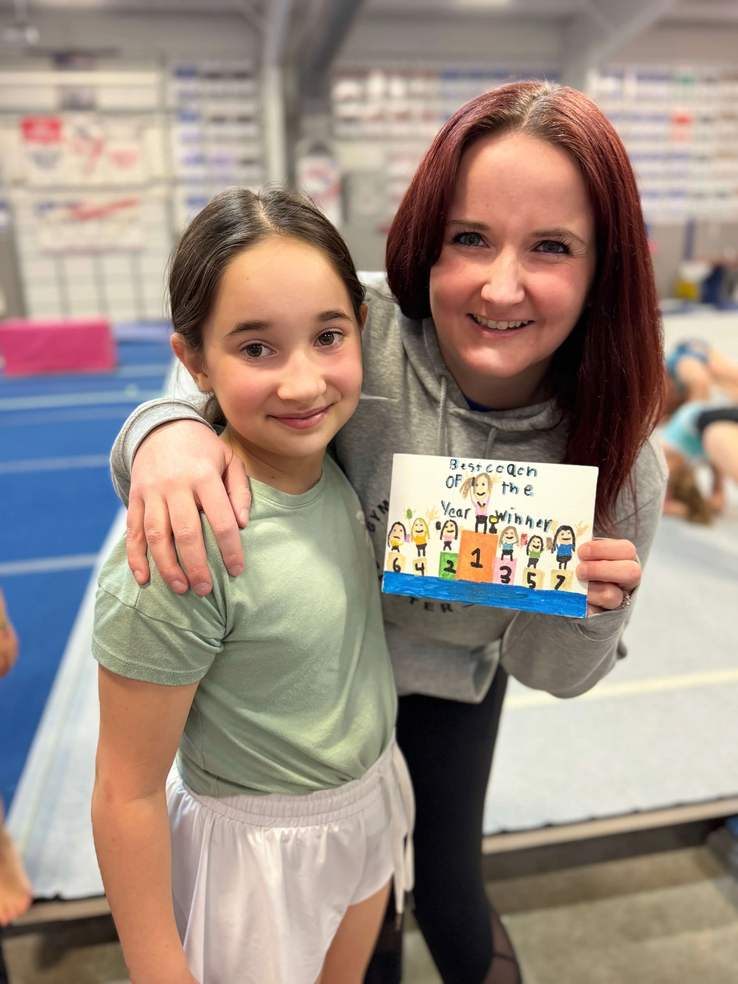 Girls gymnast with a female coach