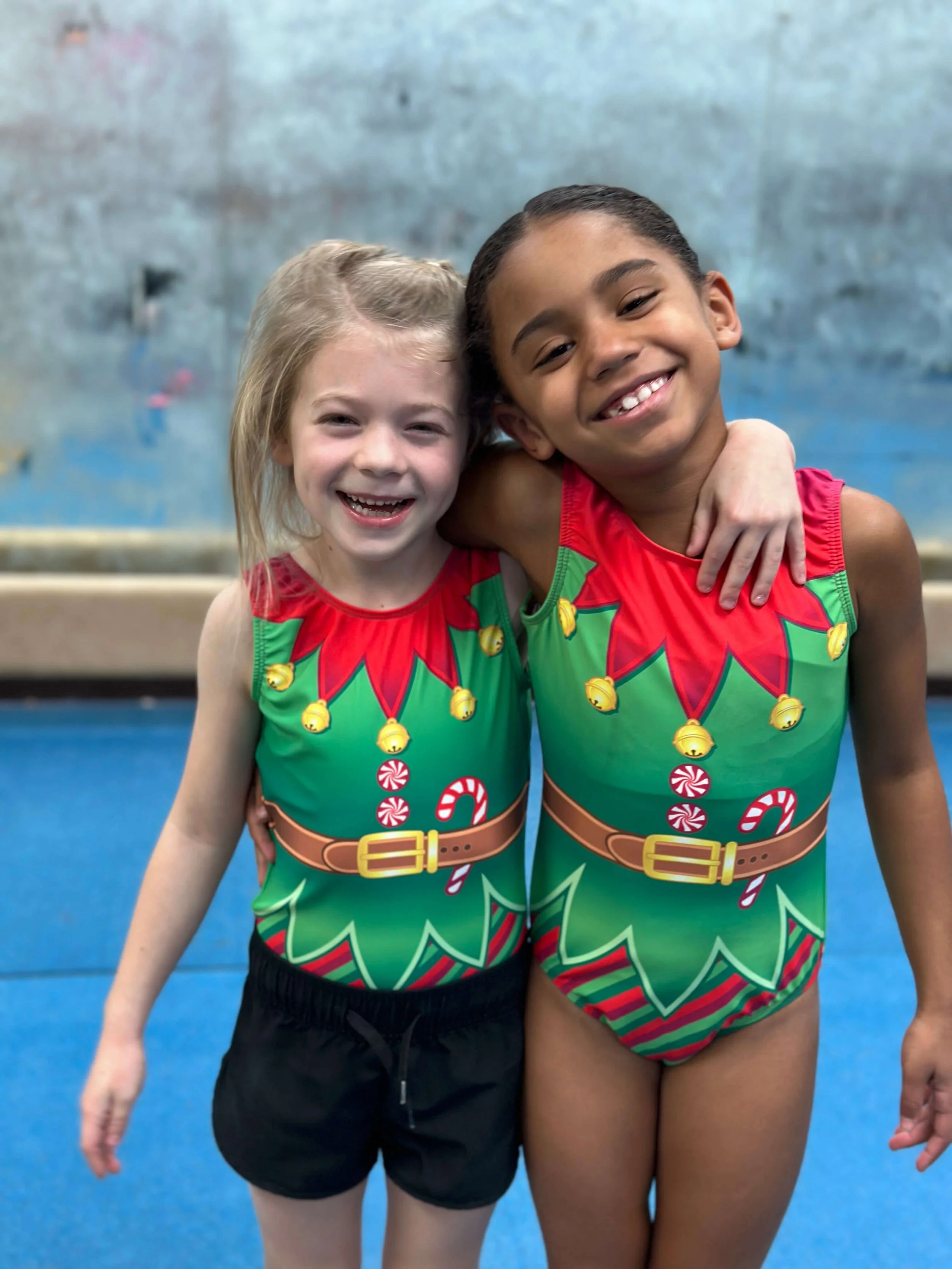Two girls in holiday leotards