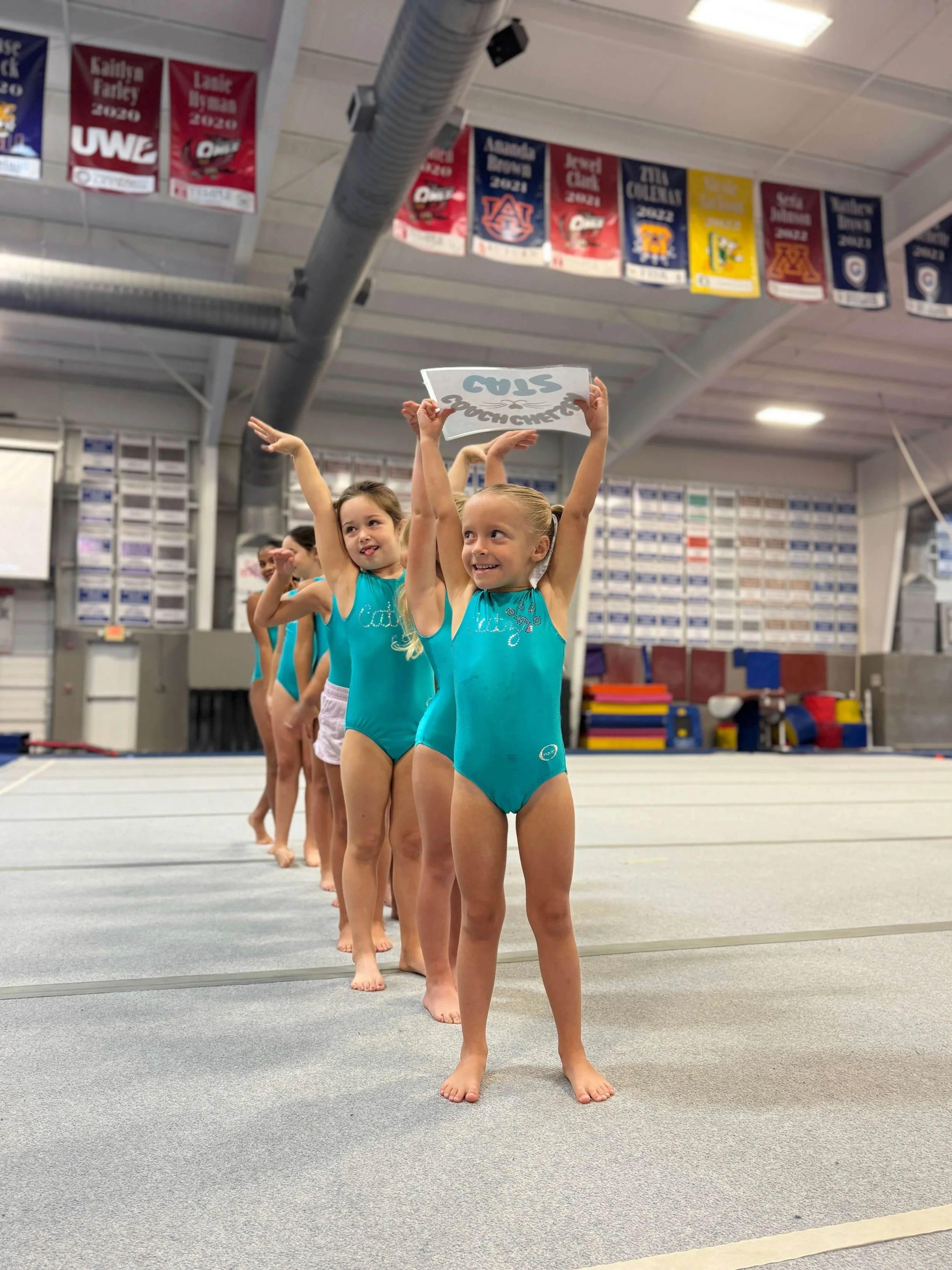 Girl gymnasts in a line