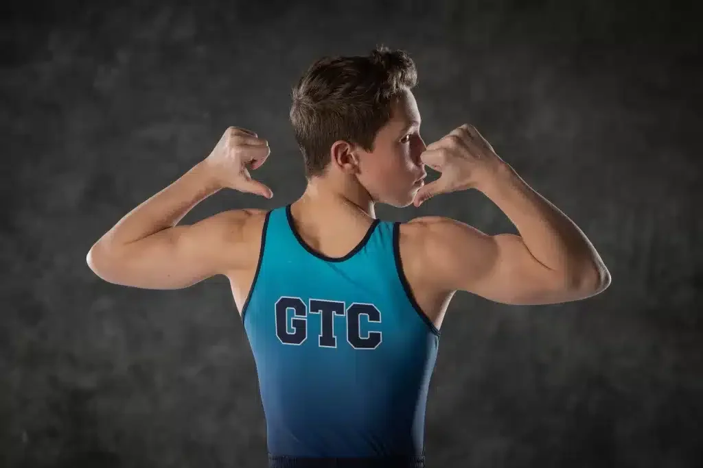 boy with a singlet saying GTC on the back