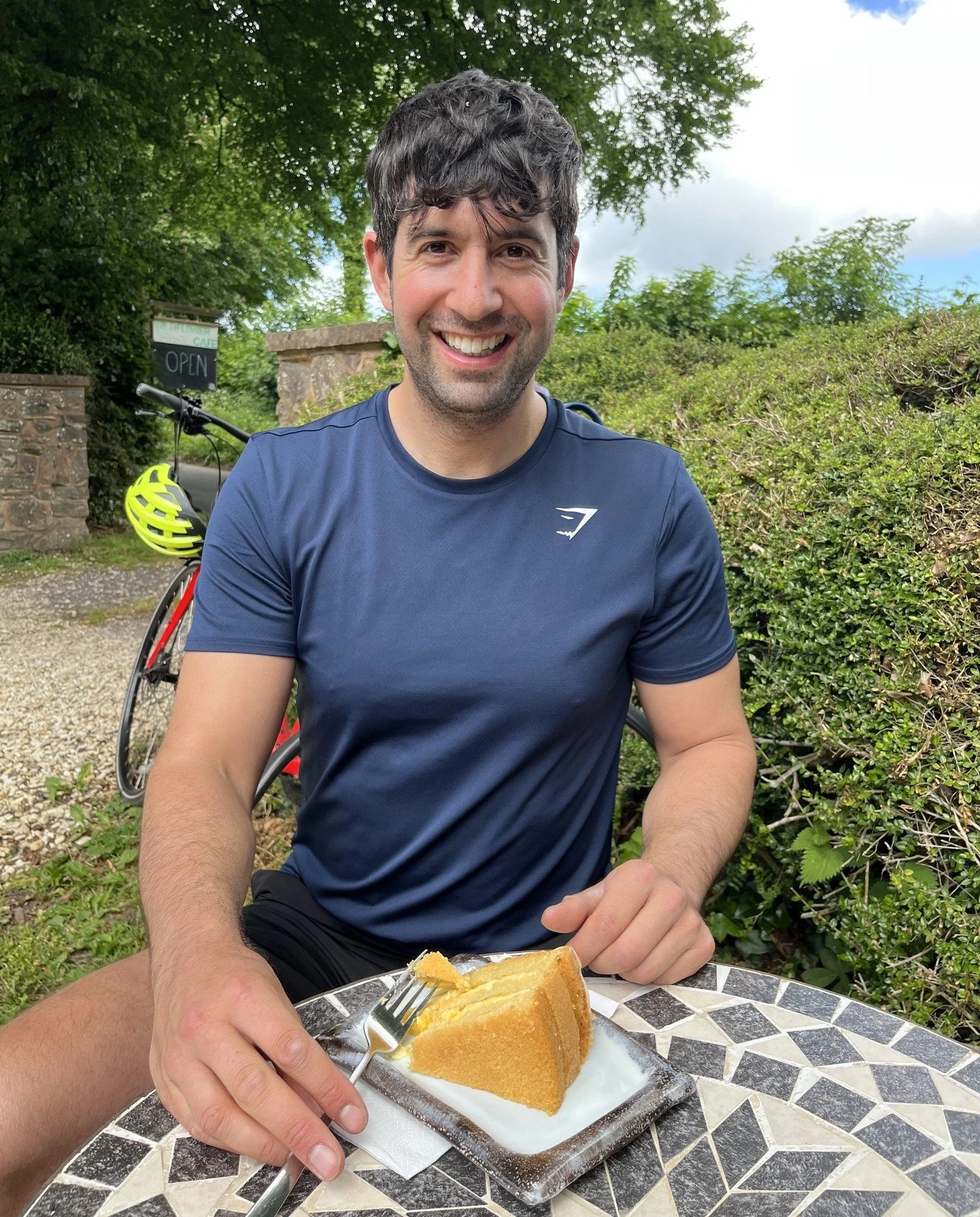 Laurie with bike and cake