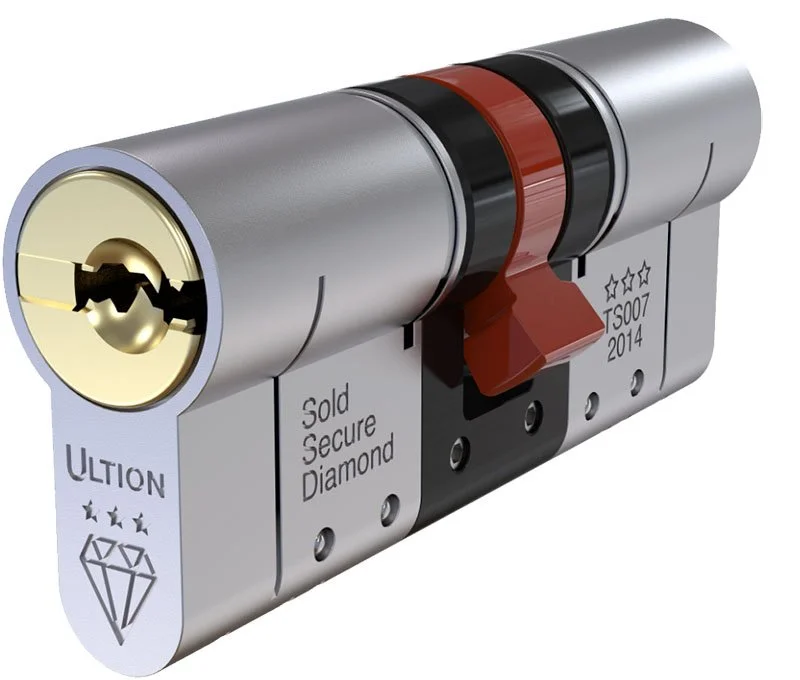A close-up of a high-security lock cylinder with the brand name ULtion, featuring a black and red key and markings for a diamond and stars indicating security standards. part of a Complete Fire and Security System in Southampton, Hampshire.