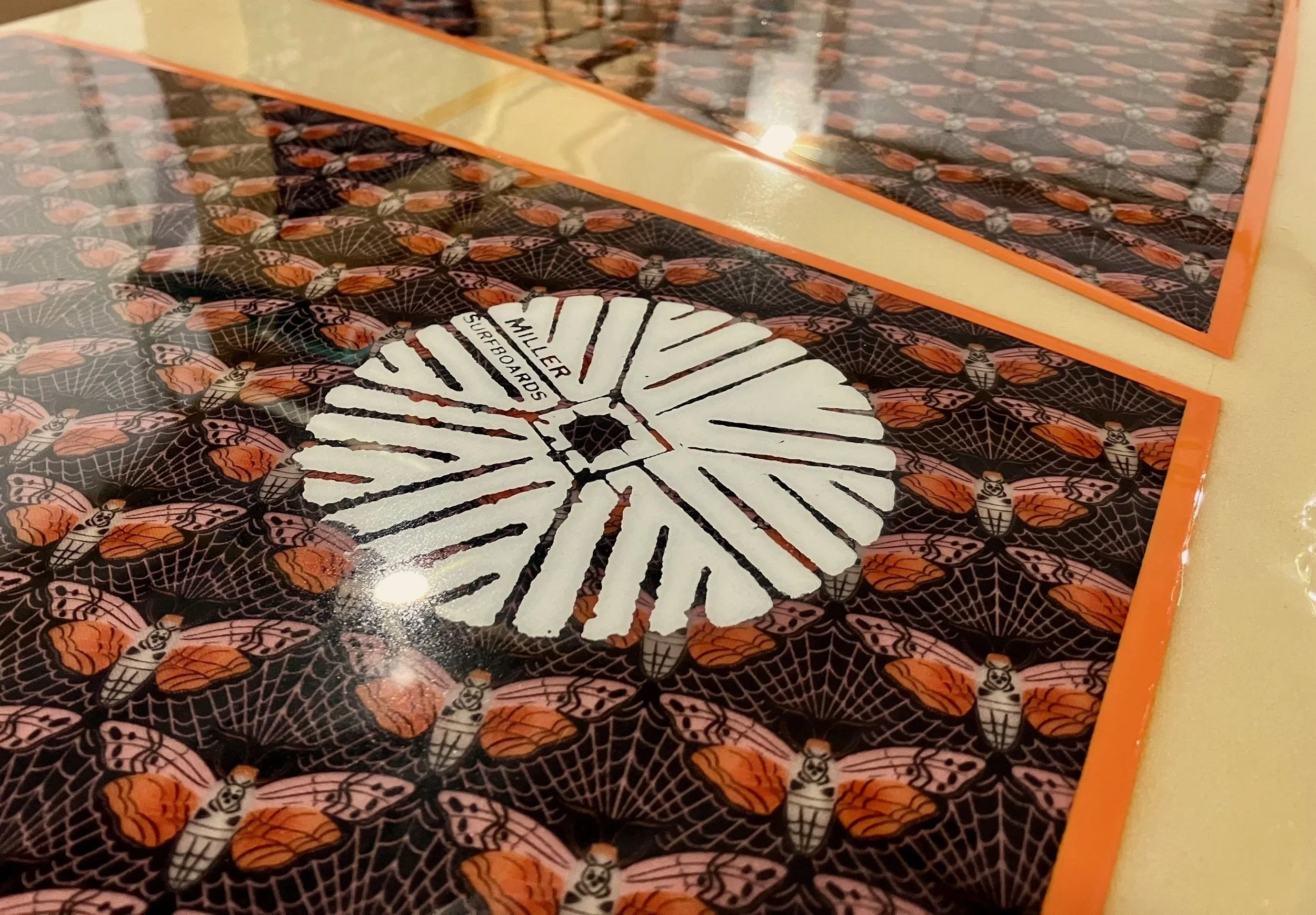 insect fabric inlay on custom pin tail longboard