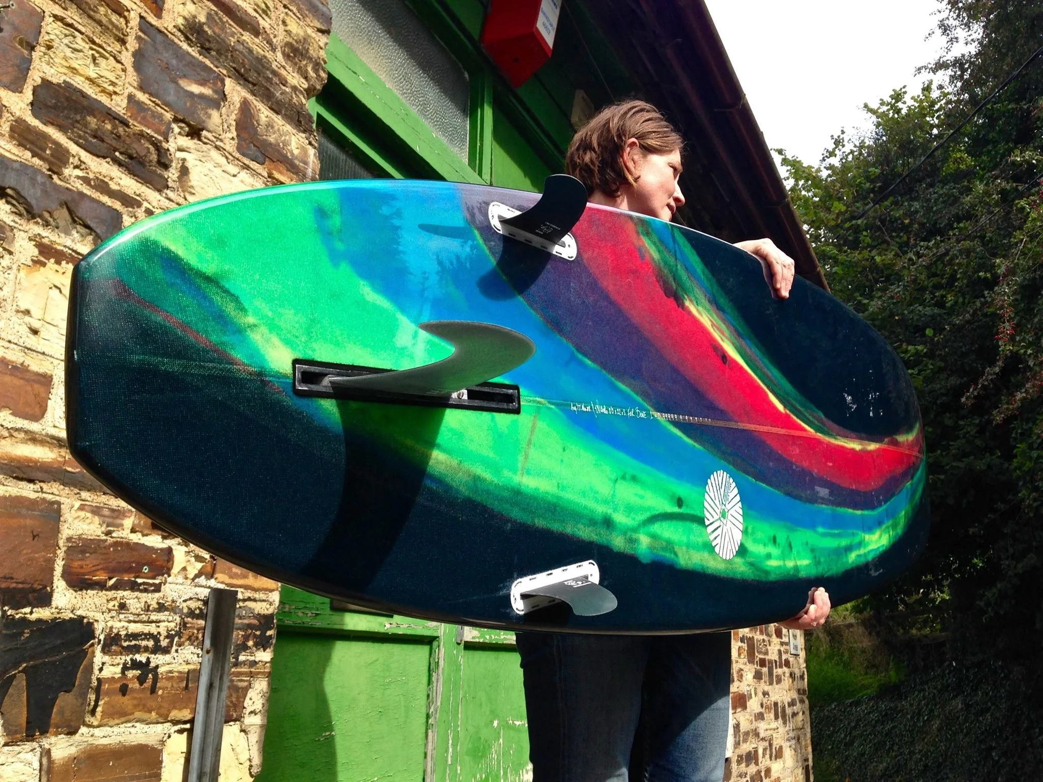 rainbow colour abstract resin tint minimal surfboard with side bites 