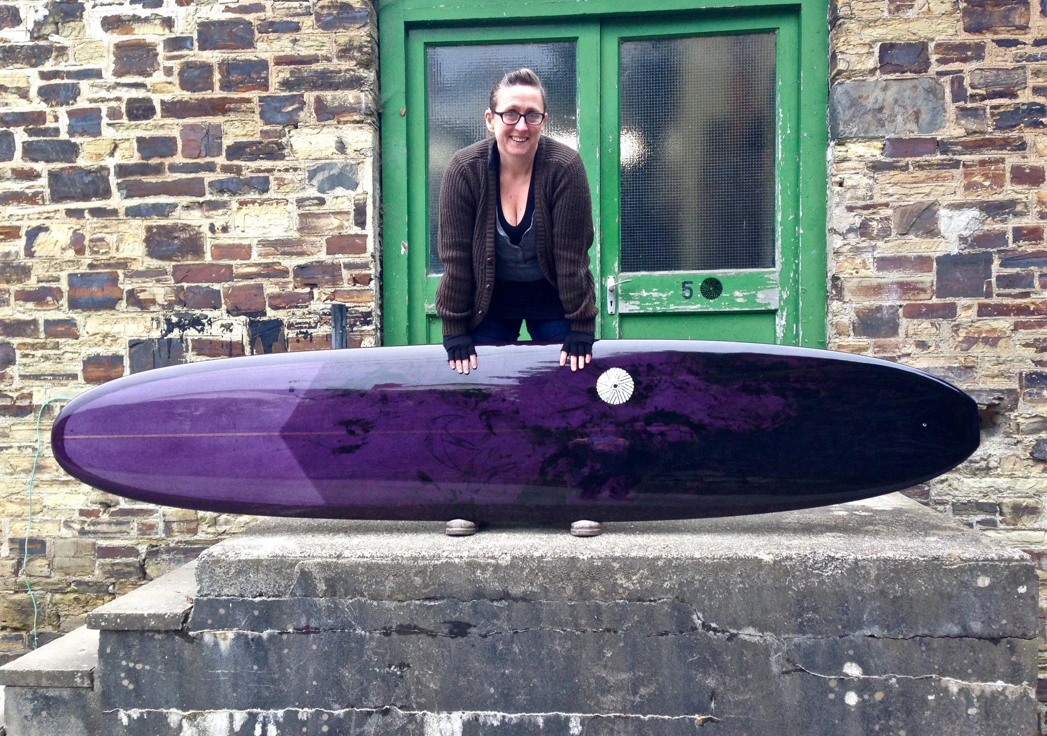 pin longboard surfboard in purple resin tint with black abstract bird artwork