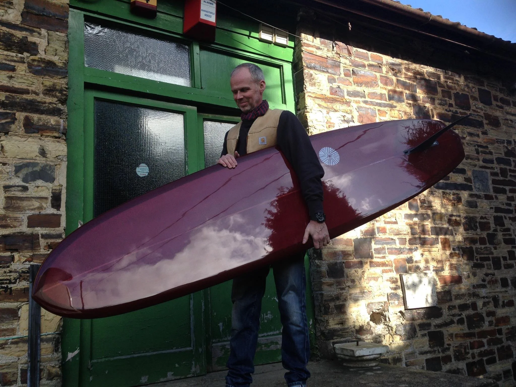 ox blood resin tint mid length single fin surfboard