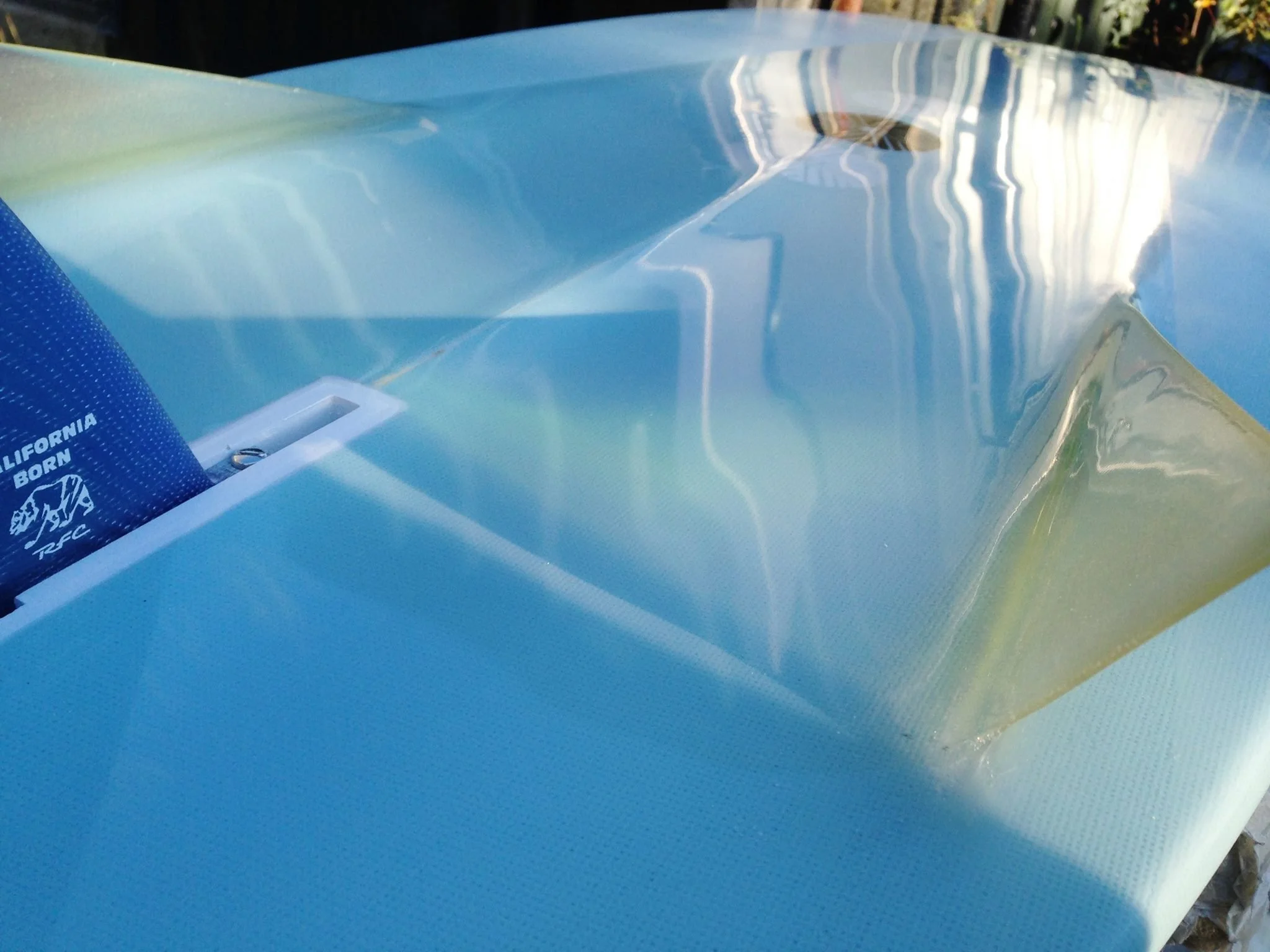 Campbell bros. style bonzer surfboard with blue resin tint