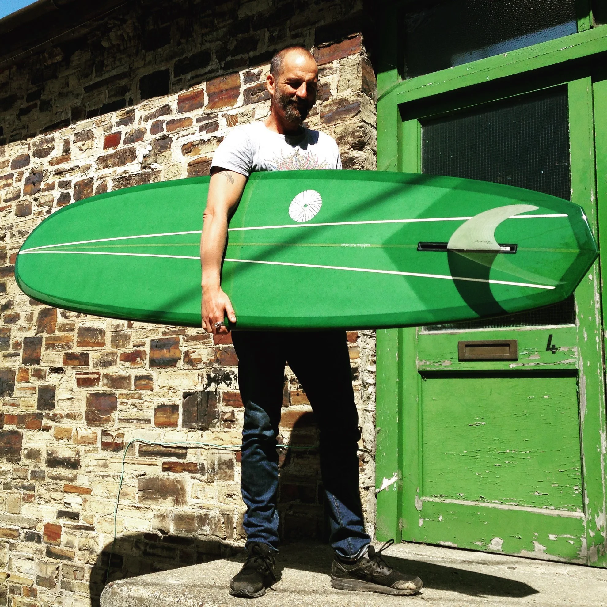 green resin tint and resin pin-line mid length surfboard