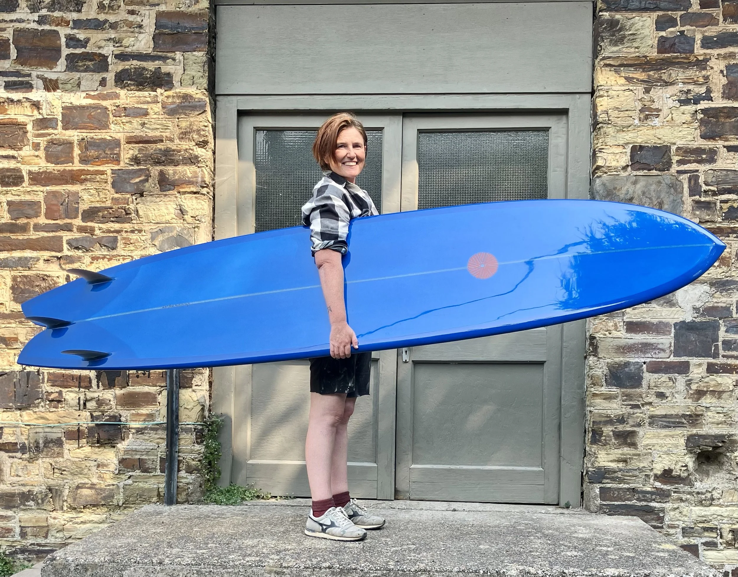 custom blue resin tint glider skip frye surfboard