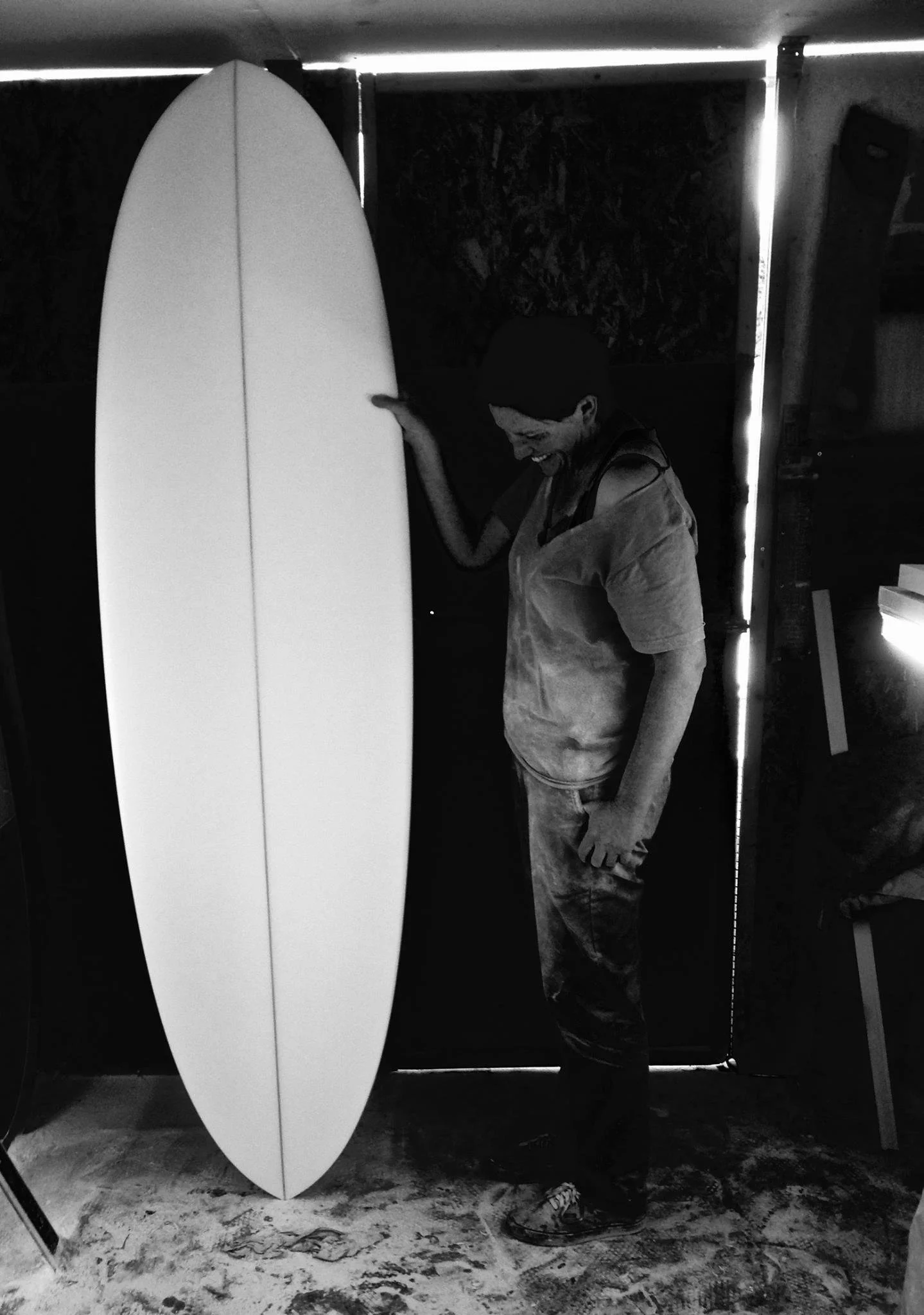 single fin mid length surfboard hand shaped in garage