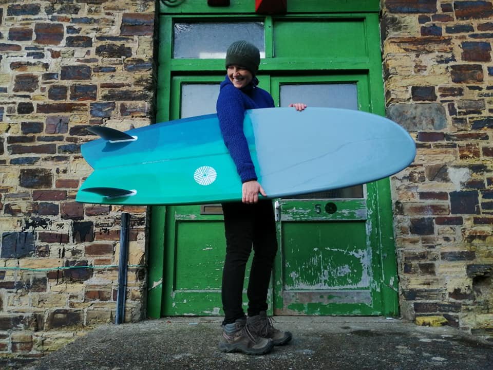 great turquoise and blue swallow tail mini Simmons fish surfboard