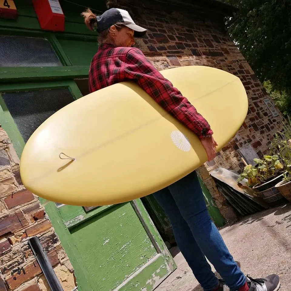 lemon yellow resin tint shortboard surfboard with matte satin finish