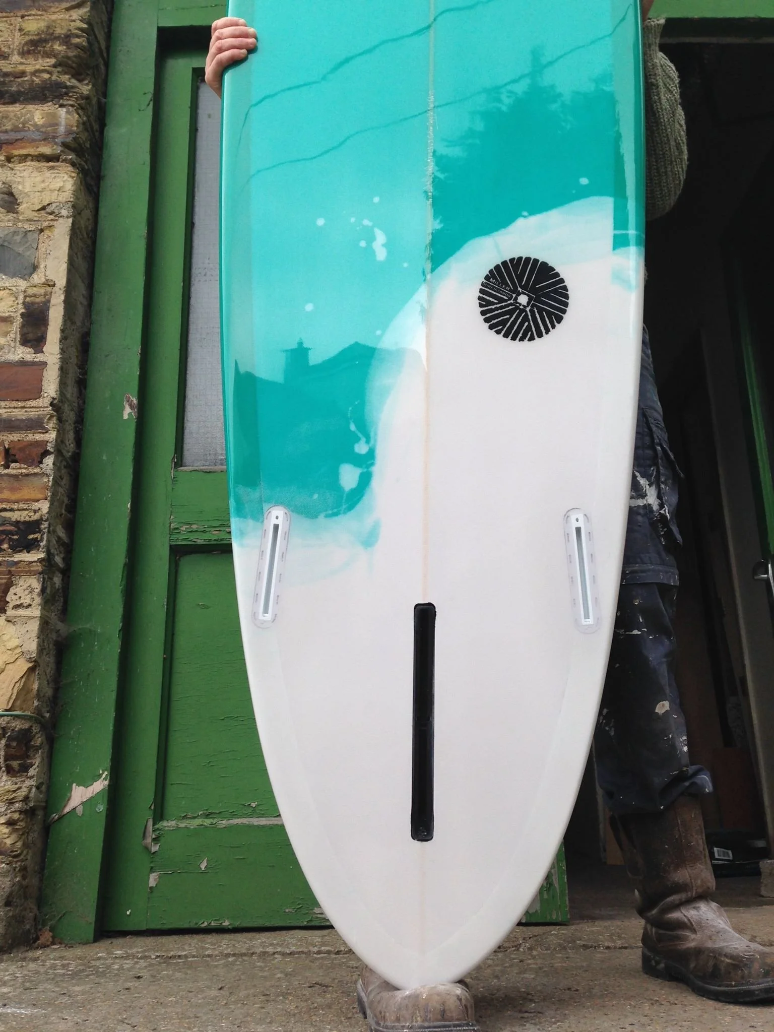 abstract white and turquoise resin tint surfboard