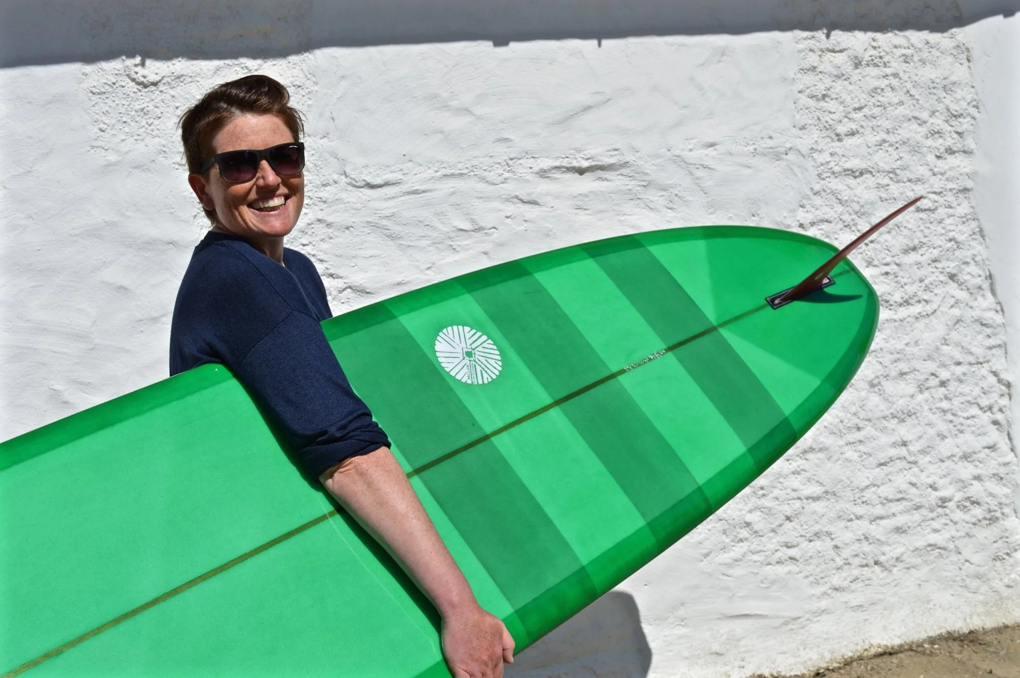 noserider surfboard in green resin tint with single fin