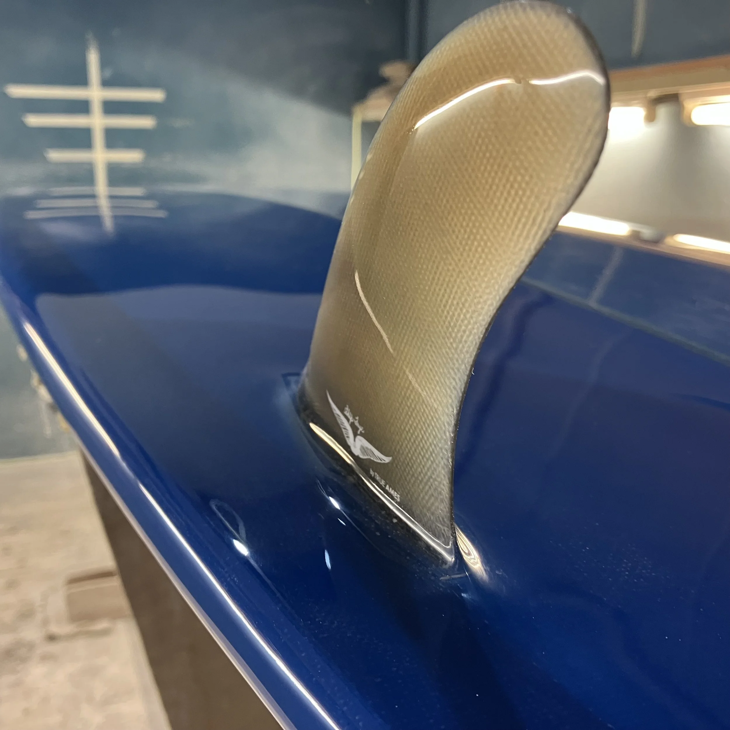 skip frye glassed on tai fin set on glider longboard