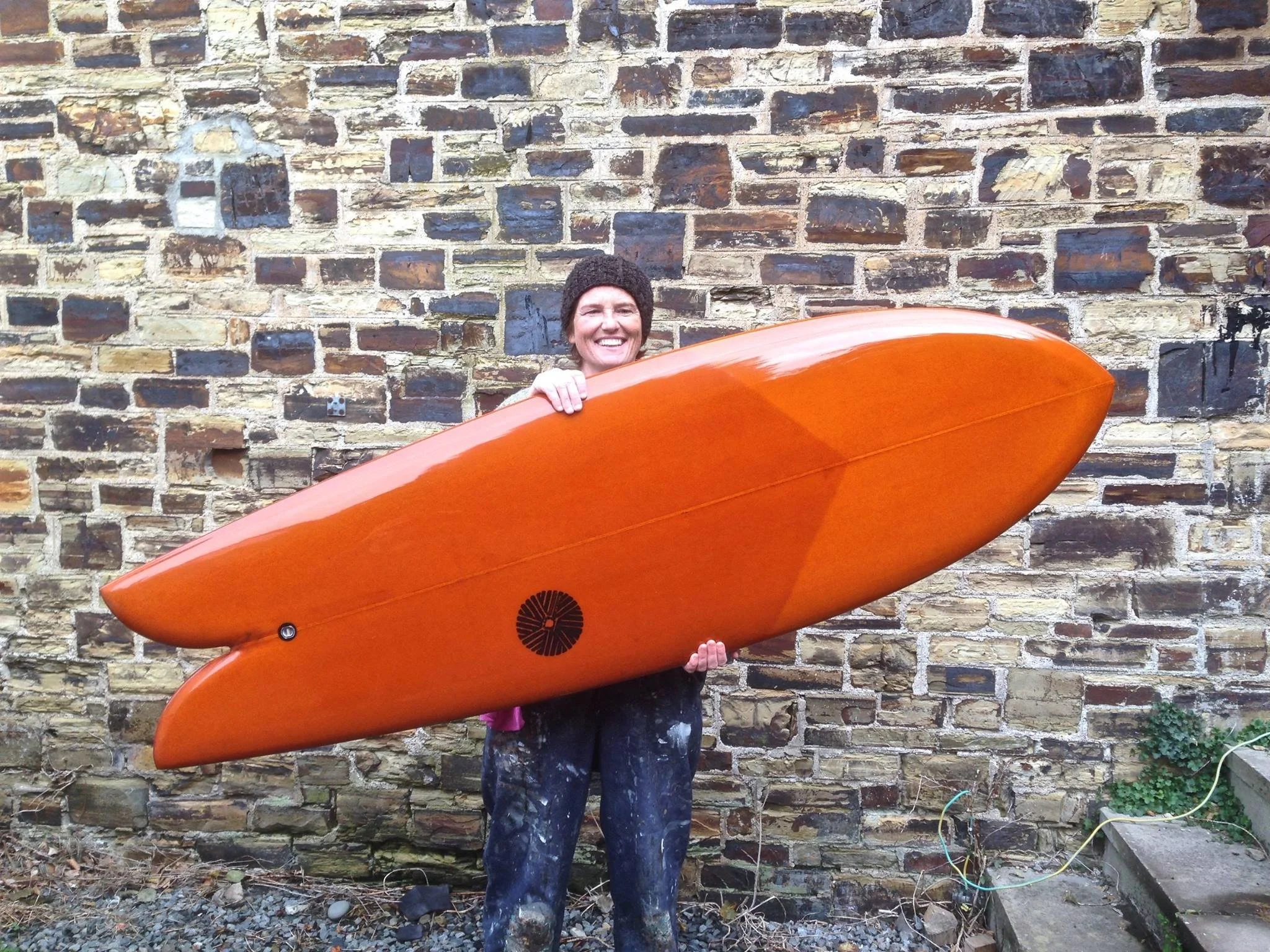 dark orange resin tint fish twin fin surfboard