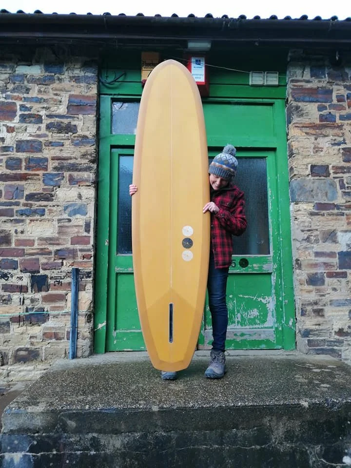 mustard yellow matte finish surfboard