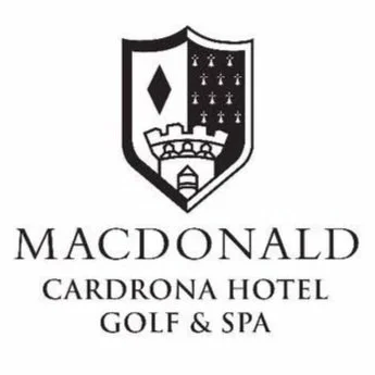 Logo for MacDonald Cardrona Hotel Golf & Spa, featuring a shield with a diamond shape, a castle, and crosses, with the hotel's name below.