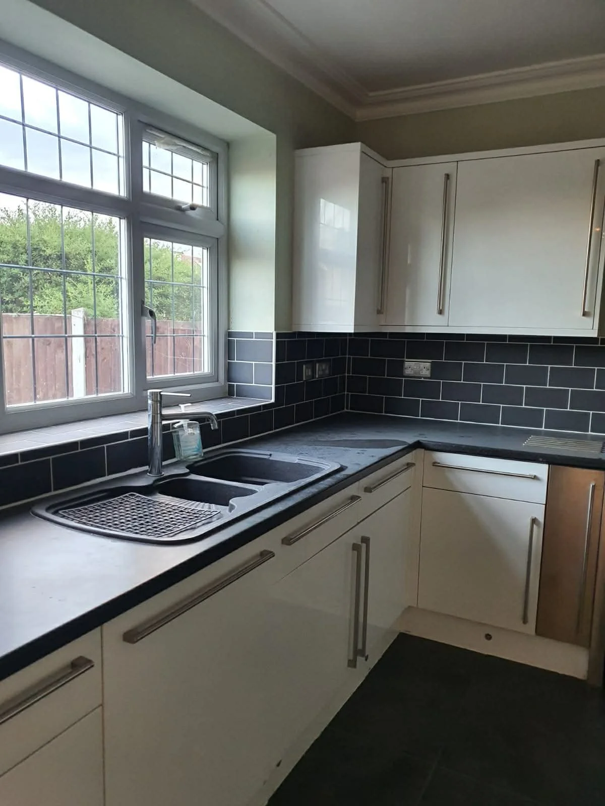 Bright and spotless kitchen after a thorough professional clean.
