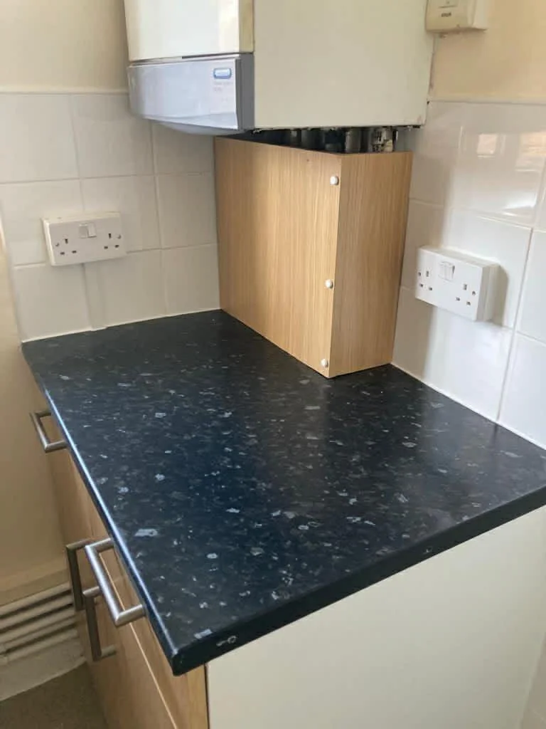 Kitchen worktops and surfaces carefully cleaned and polished during a professional house clean