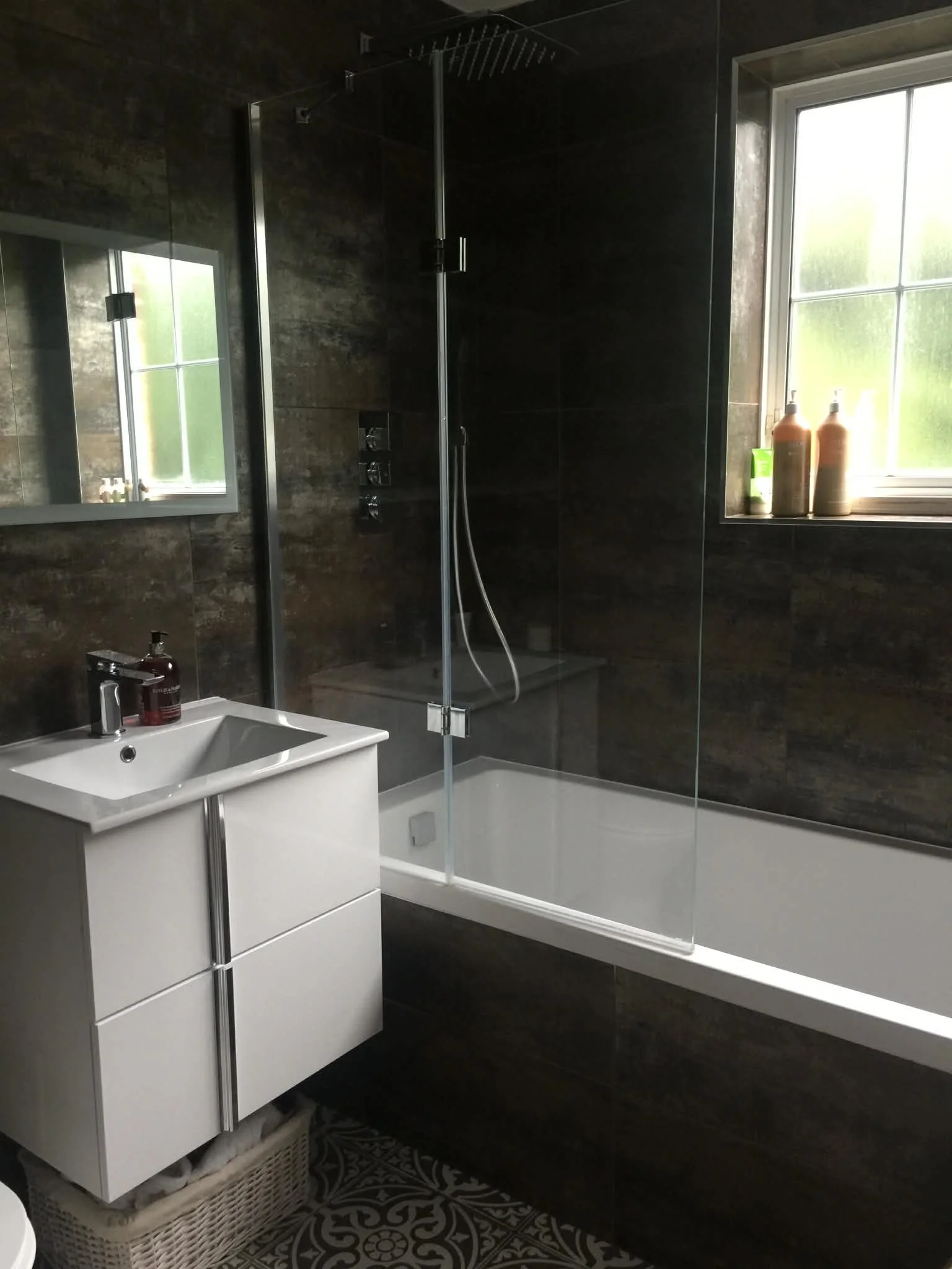 Bathroom deep cleaned with attention to tiles, glass and fixtures for a spotless finish