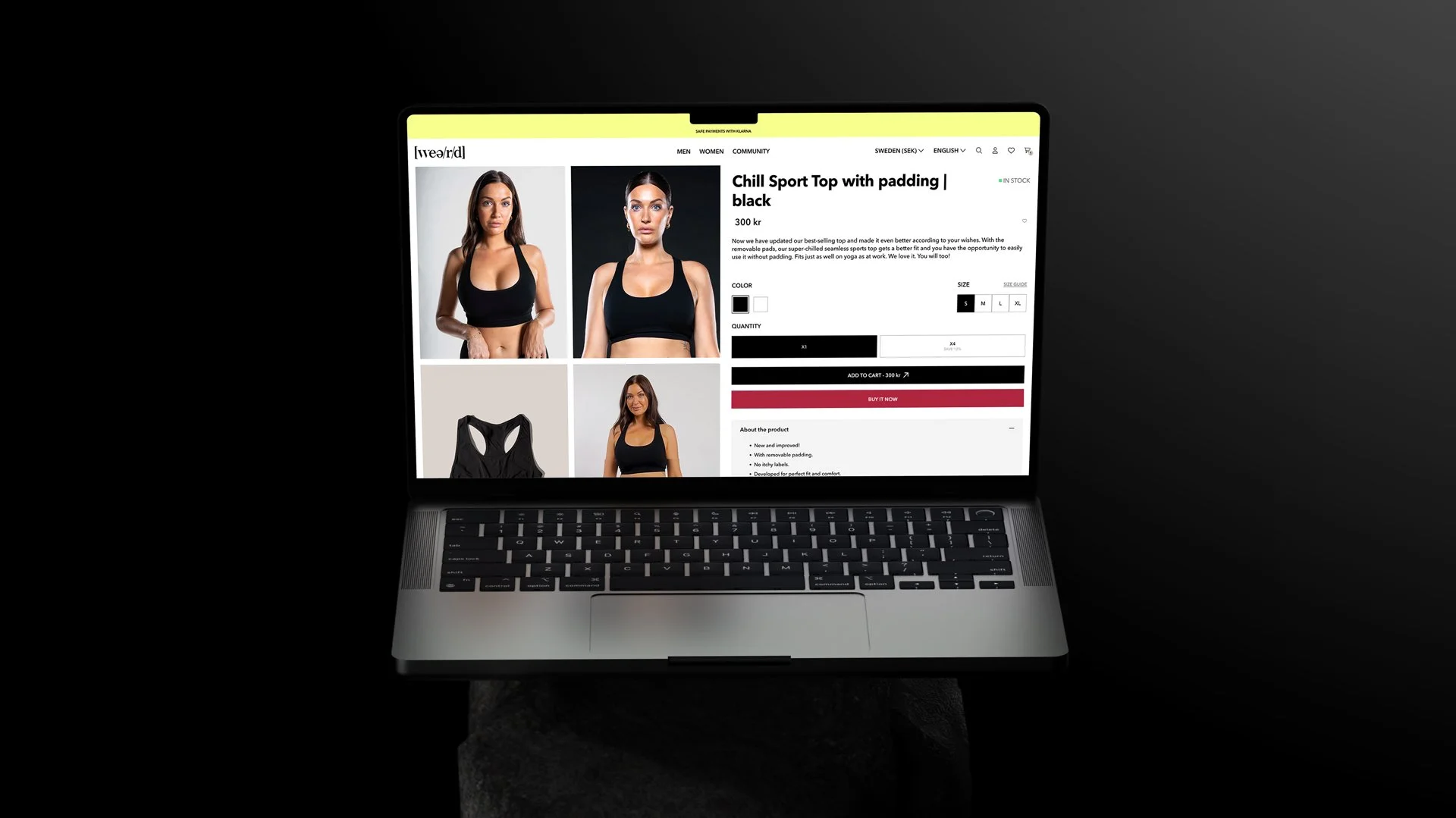 Laptop displaying an online store of weard.com. The page shows multiple images of the sport top being worn and detailed product information, including color options, sizes, and a purchasing section.