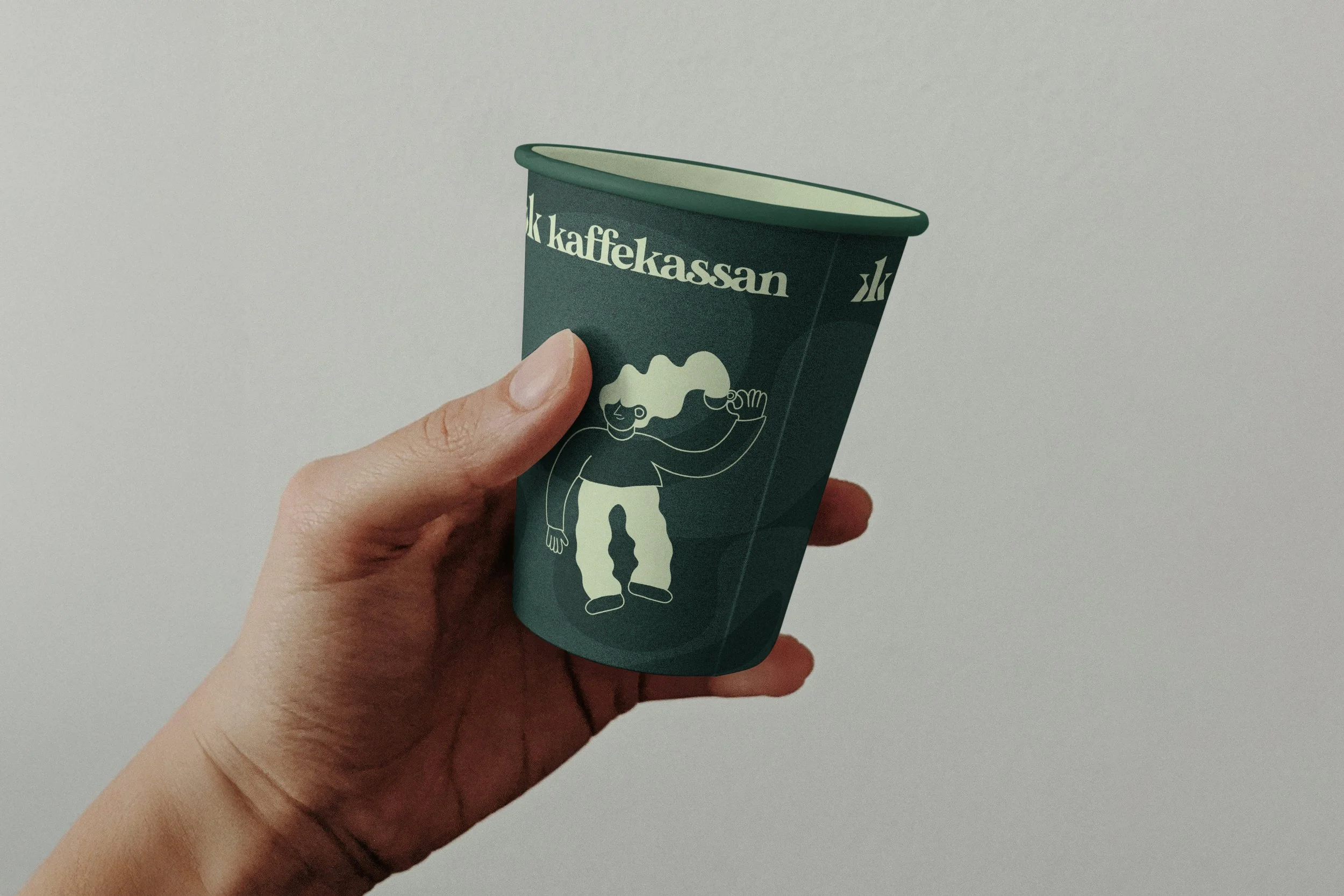 Free-Paper-Coffee-Cup-in-Hand-Mockup.jpg