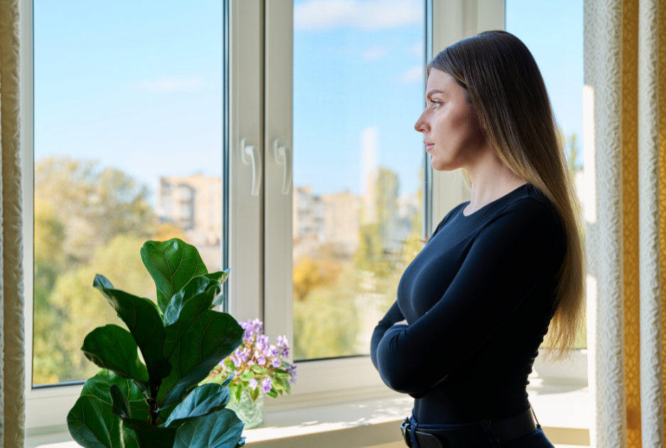 Woman reflecting thoughtfully during HAPI relationship coaching, supporting emotional clarity and personal growth