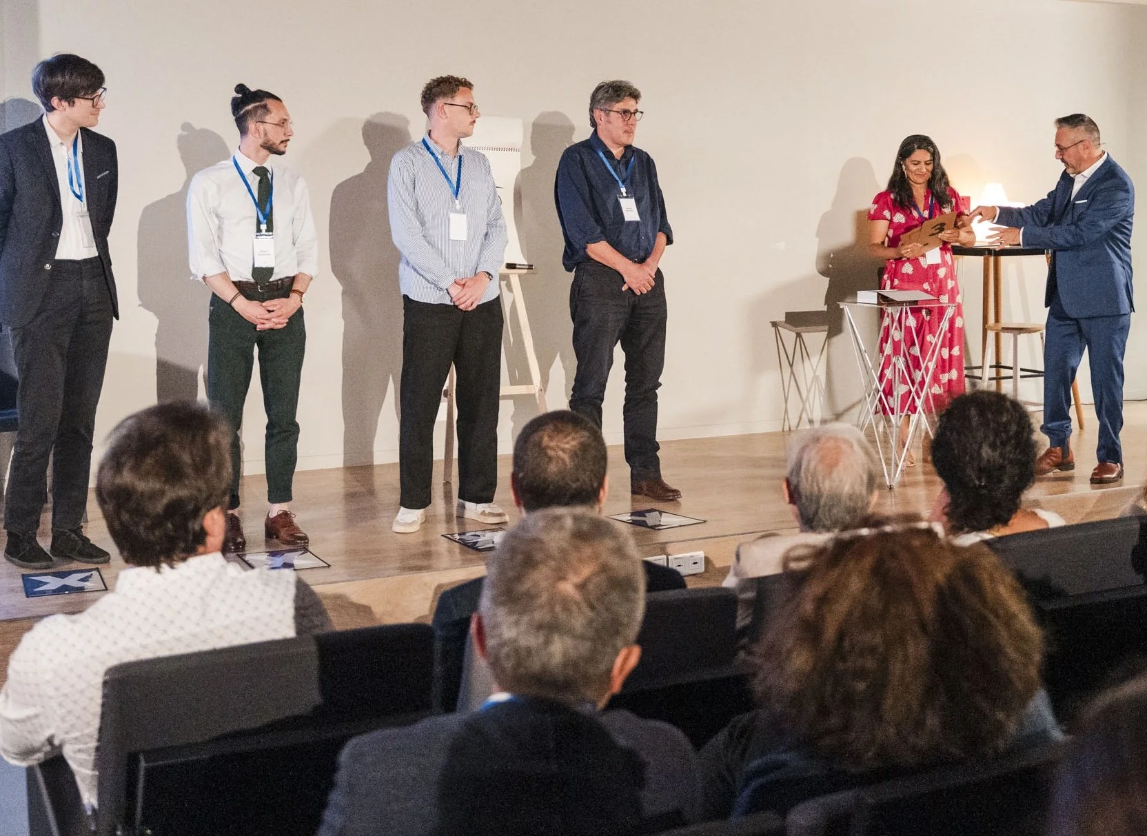 Participants on stage during a mentalism team building led by Jerome Viro