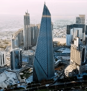 Aerial view of Burj almana tower surrounding skyscrapers.