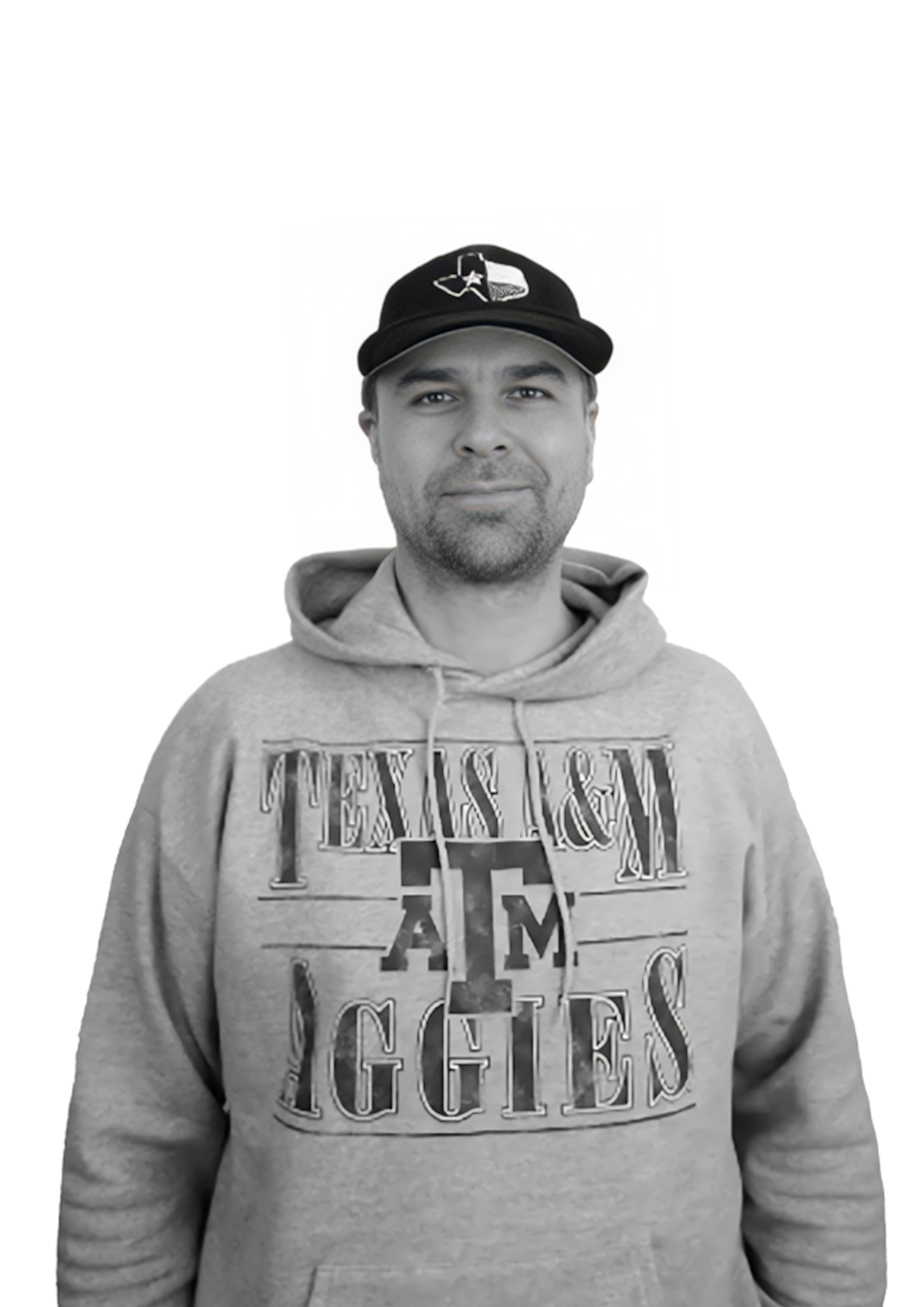 A man wearing a baseball cap and a hoodie with the Texas A&M Aggies logo, standing against a plain background.