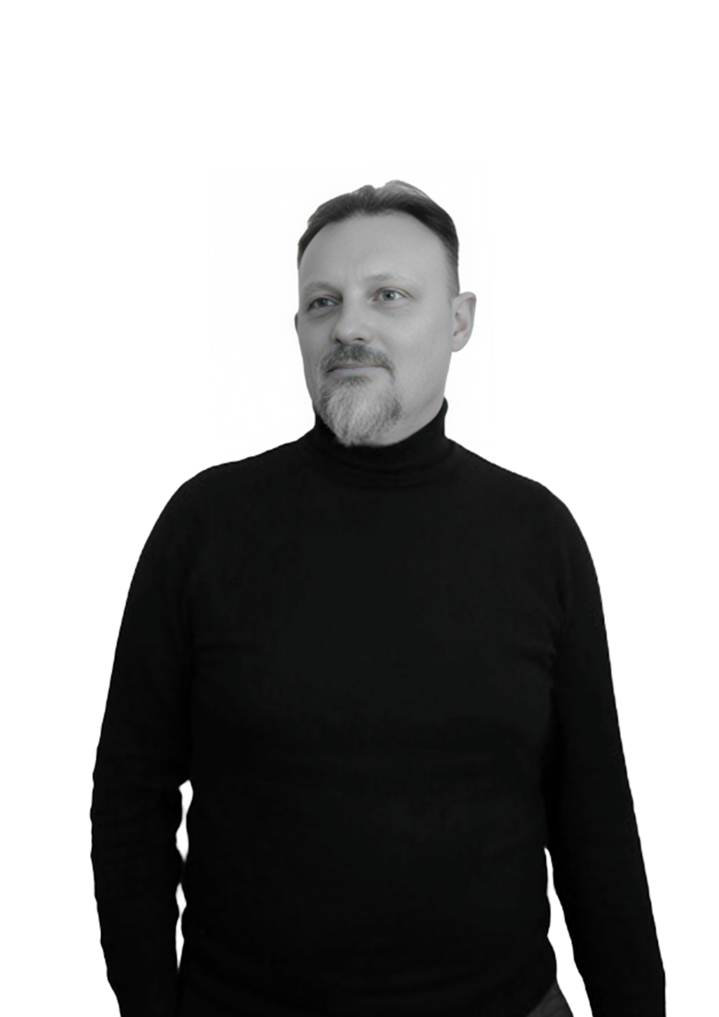 A man with short dark hair, a beard, and mustache, wearing a black turtleneck sweater, standing against a plain white background.