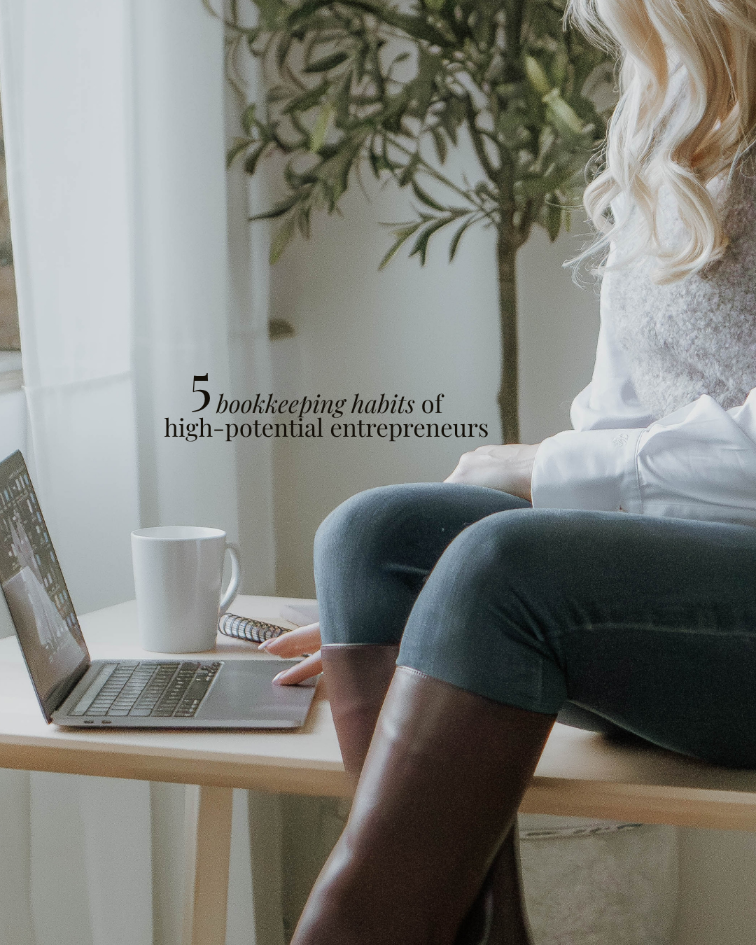 A woman sitting on a table with a laptop, coffee mug, and notebook, with a text overlay reading '5 bookkeeping habits of high-potential entrepreneurs'.