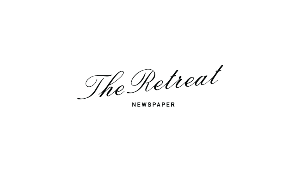 The logo of The Retreat newspaper with a stylized image of a resting person or animal on top.