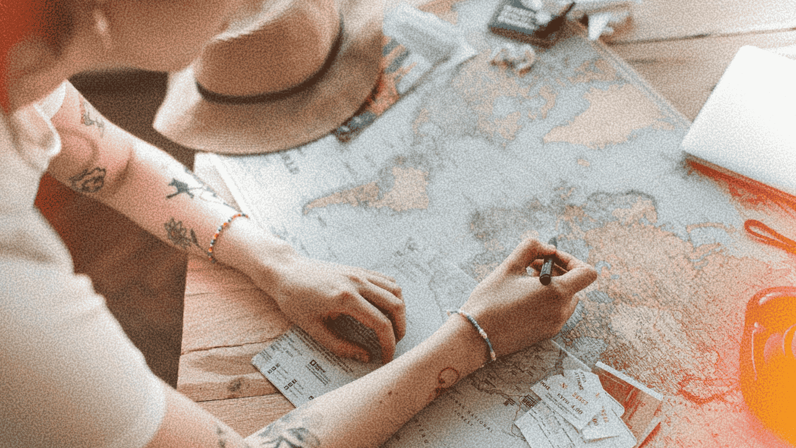 Person Looking on a map with a pen in their hand