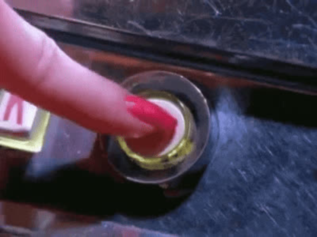 Finger pressing a reset button