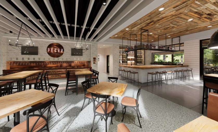 Modern restaurant interior with wooden tables, black metal chairs with orange cushions, a bar area with stools, and decorative lighting fixtures.
