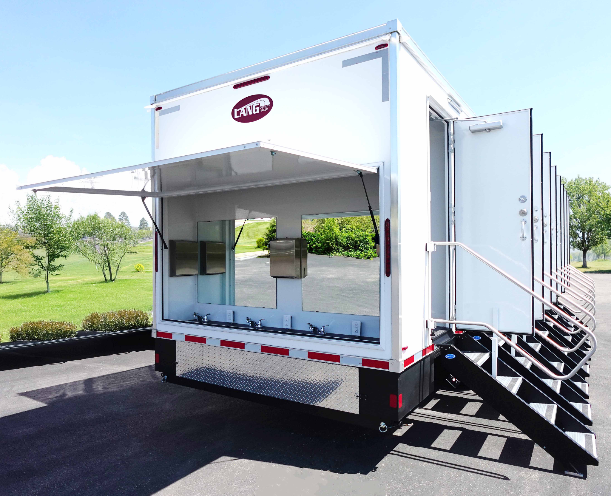 Mobile trailer with an outdoor restroom and two sinks