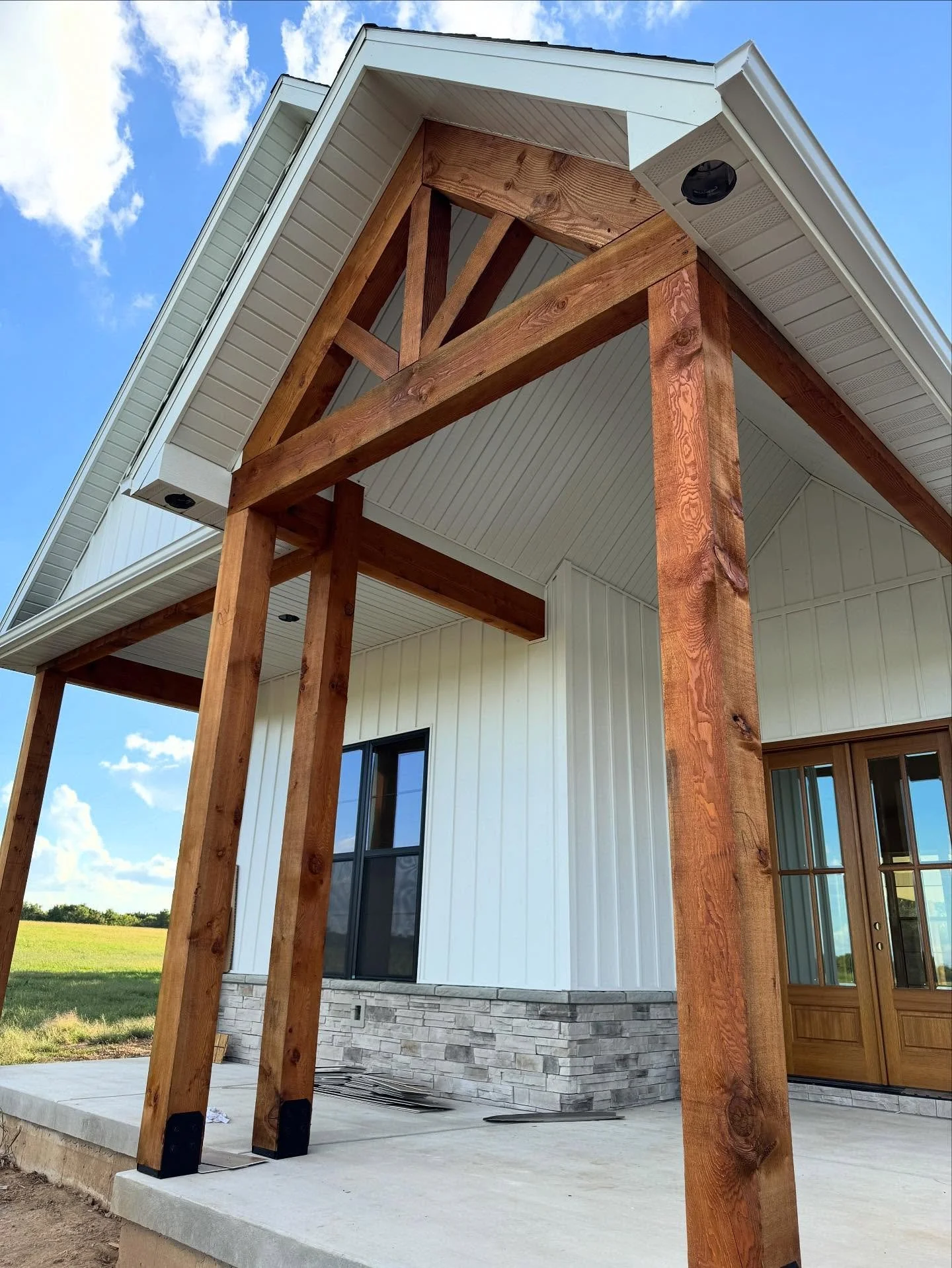 Stained posts and beams on a front porch