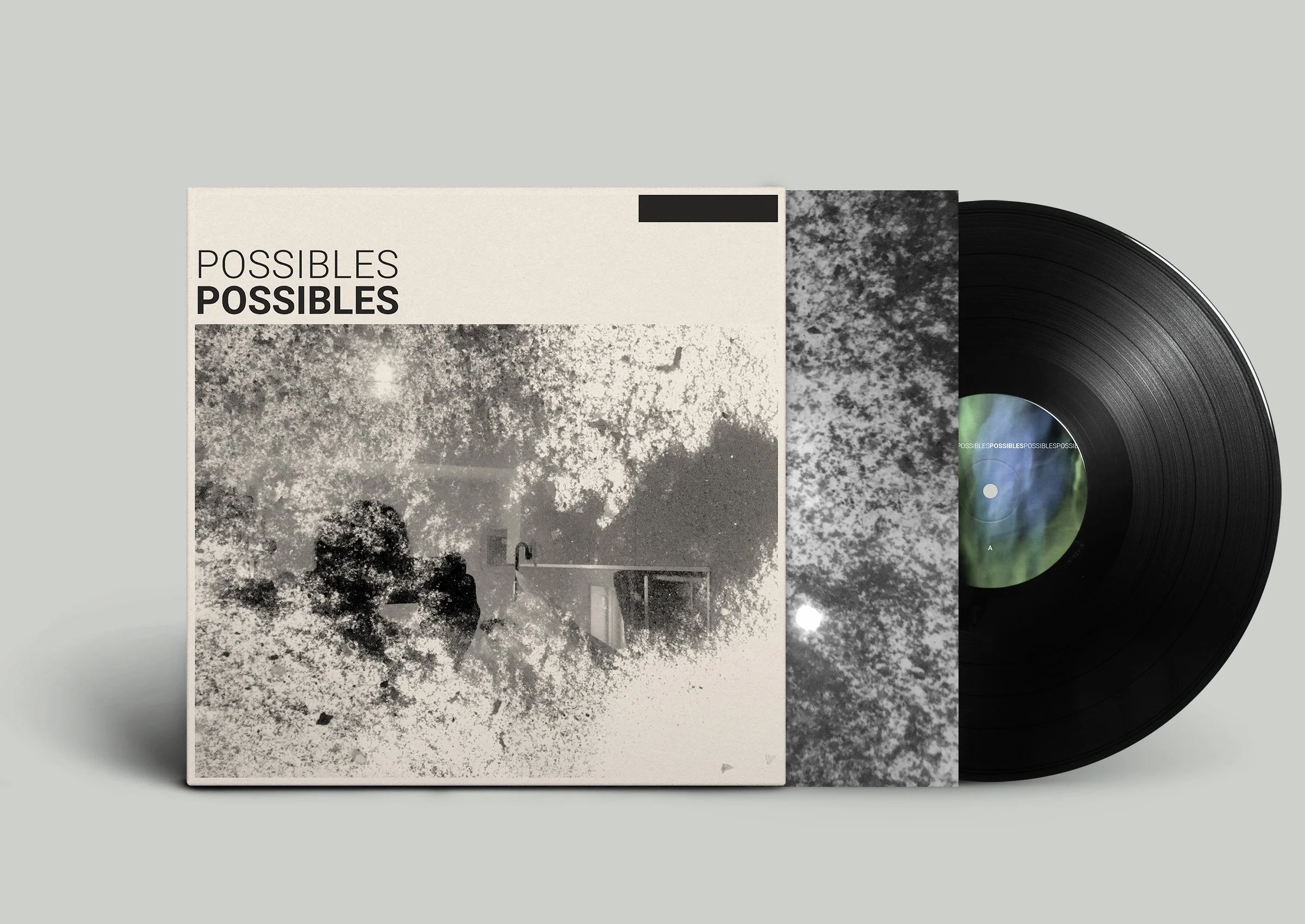 Vinyle et pochette d'album intitulée 'Possibles' avec un design en noir et blanc représentant un paysage avec des arbres et un ciel nuageux.