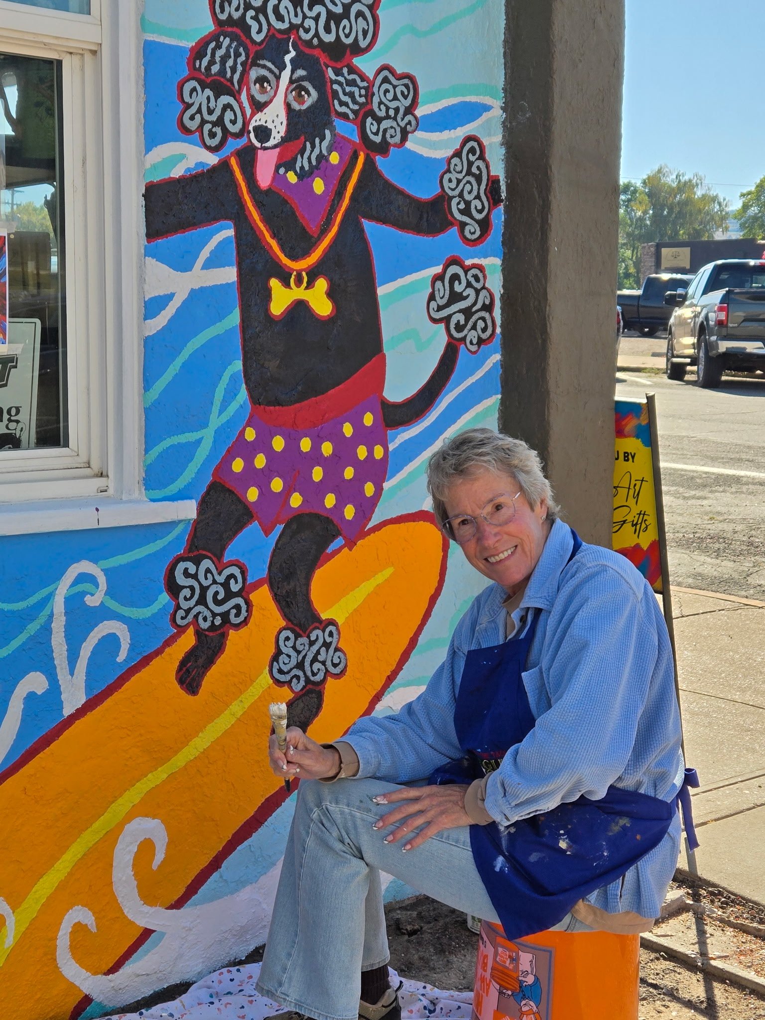 Margery Christianson painting at the Barking Lot