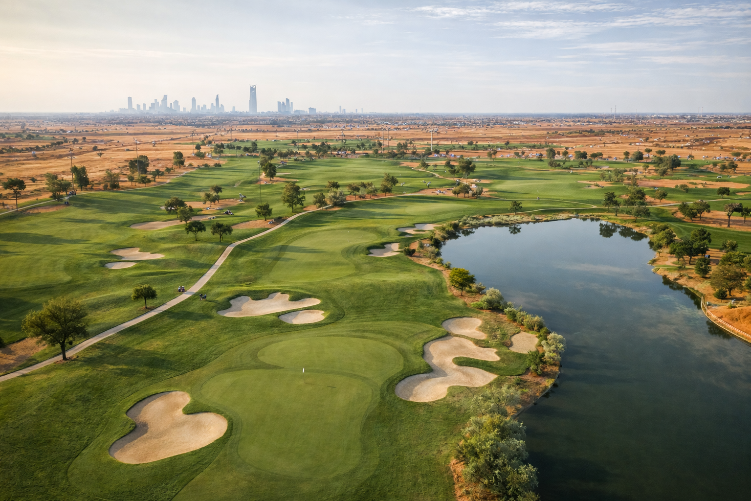 Aerial view of the wider golf landscape situating the club within its environmental context and reinforcing large-scale orientation reference.