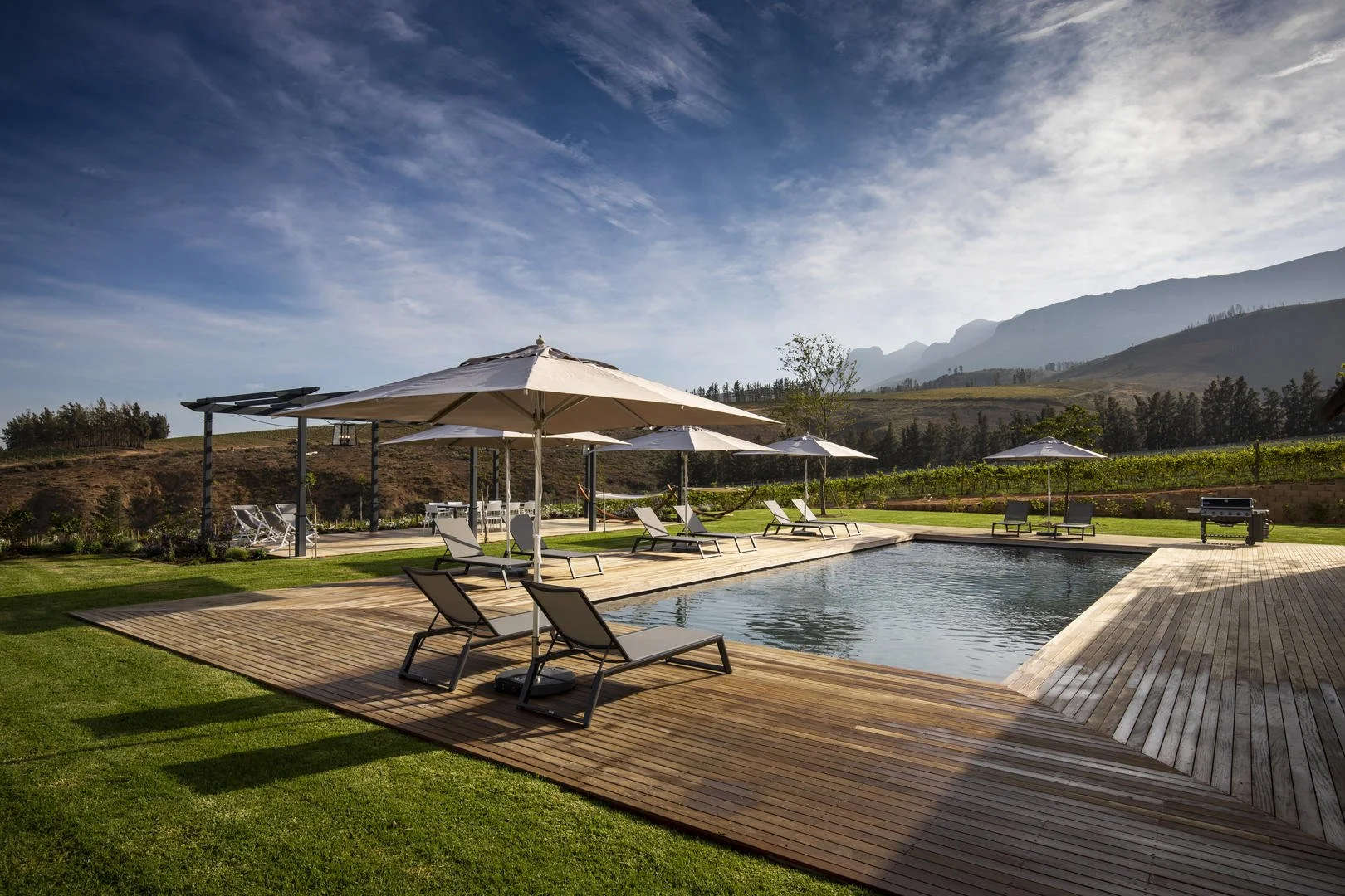 Peaceful poolside area complete with pool room 