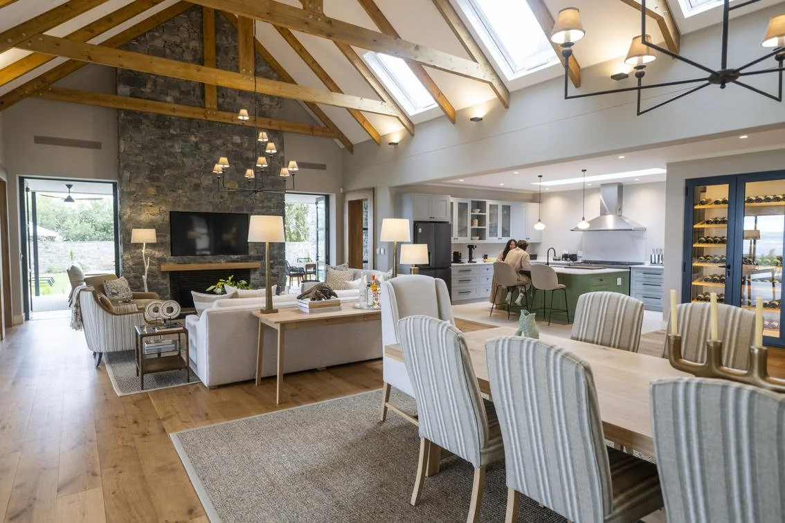 Large warm open plan living room and dining area fully serviced by a butler and chef