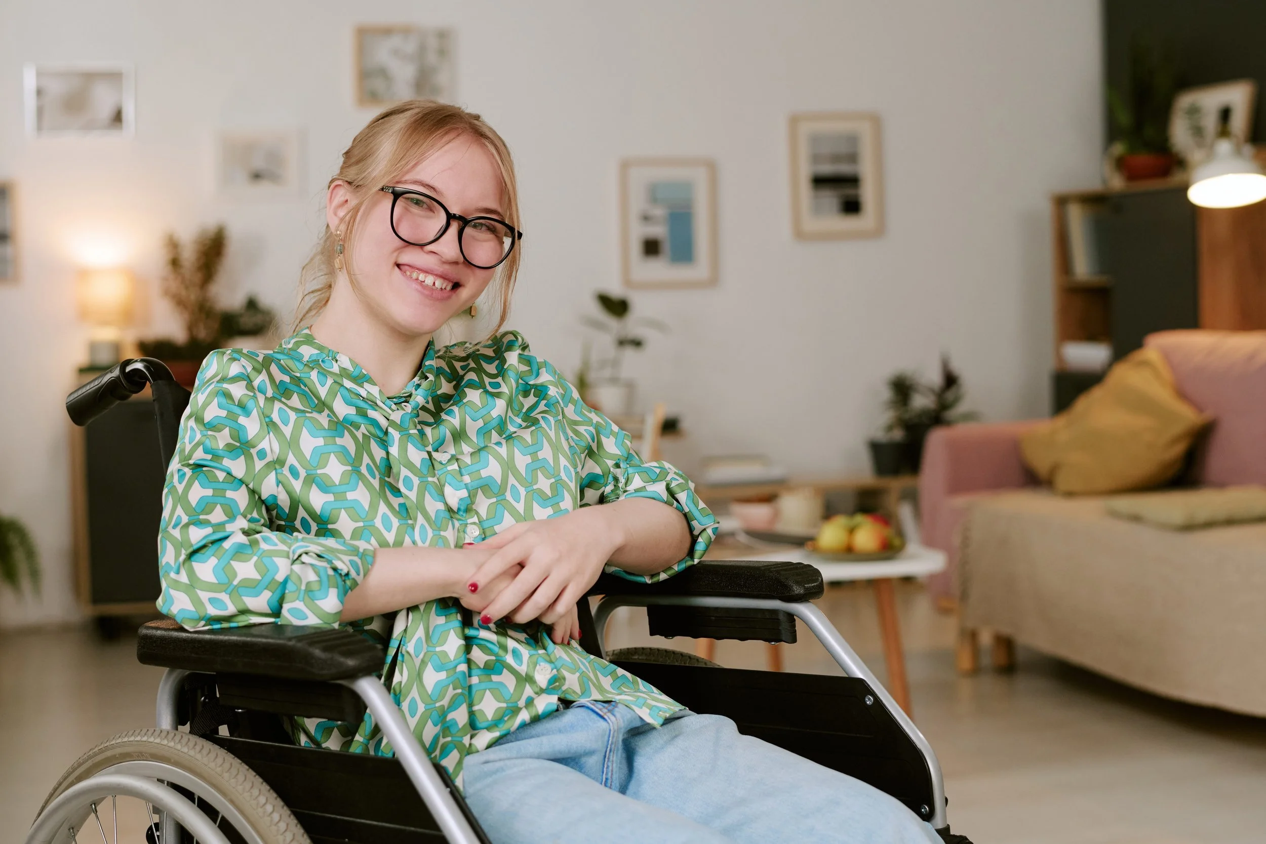 Young woman with traumatic brain injury smiling in a semi-independent living environment in Southeast Michigan
