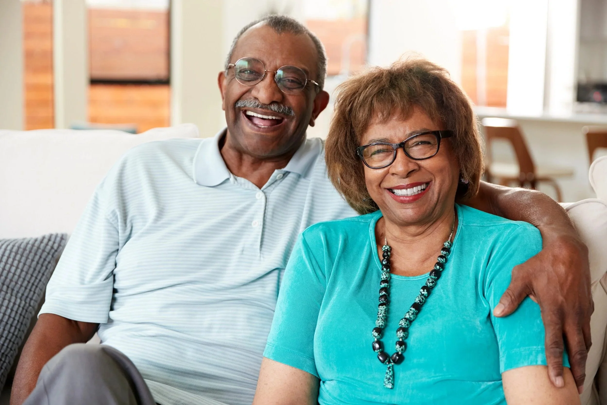Smiling TBI residents receiving person-centered care at Medical Alternatives Inc. in Southeast Michigan